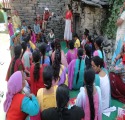 Community members gathered at an outdoor programme event