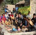 Community members and programme participants gathered outdoors