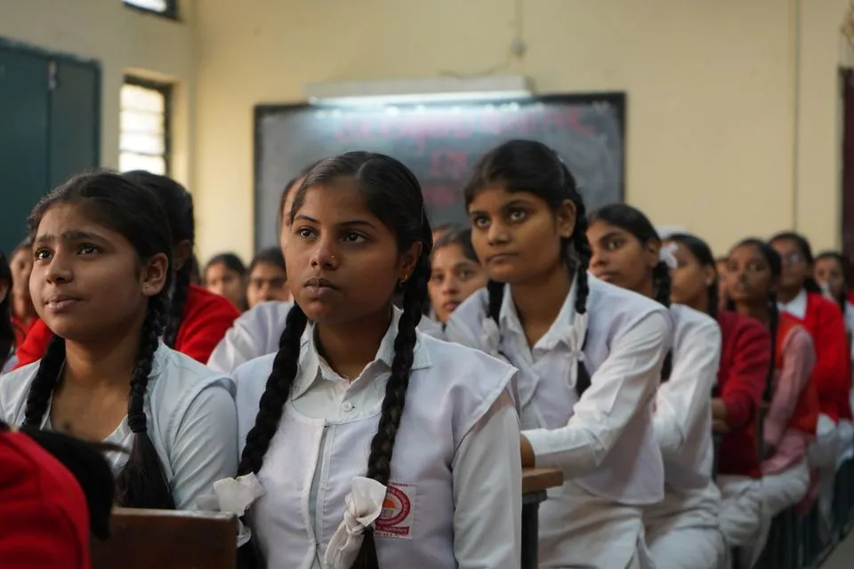 Students attending a classroom learning session in India