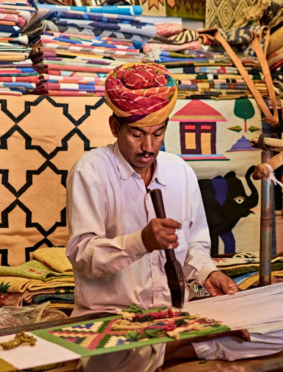 Indian artisan working on traditional textiles in Rajasthan