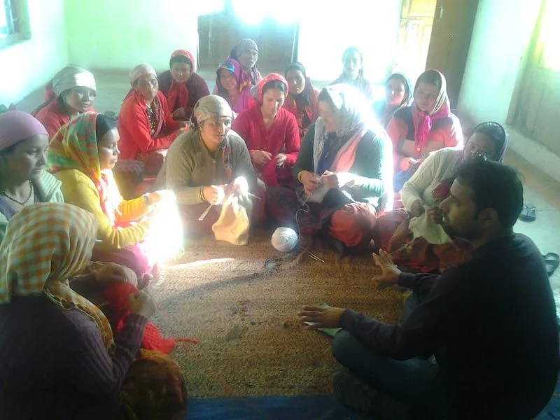 Participants seated together during a Bhotia Tribe programme discussion