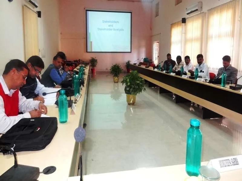 Participants around a conference table during forestry training
