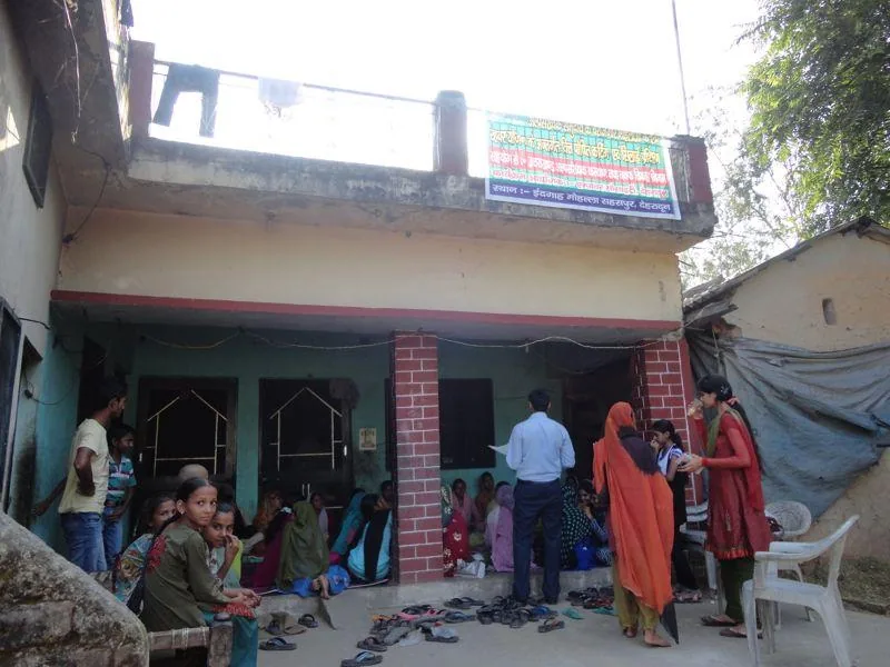 Participants outside a community programme venue