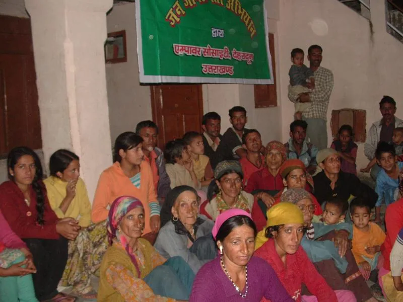 Participants seated for a community awareness session in Jaunsar
