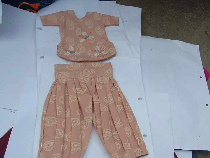 Handmade dress with a pleated skirt and decorative details